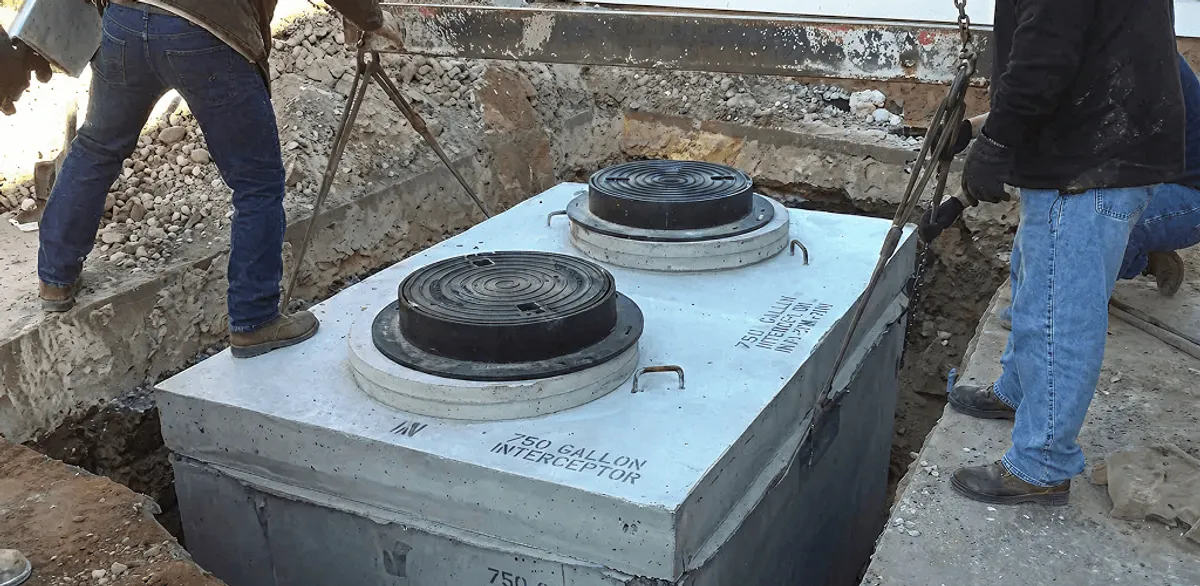 Grease trap installation for a commercial property drainage system in Des Moines, IA