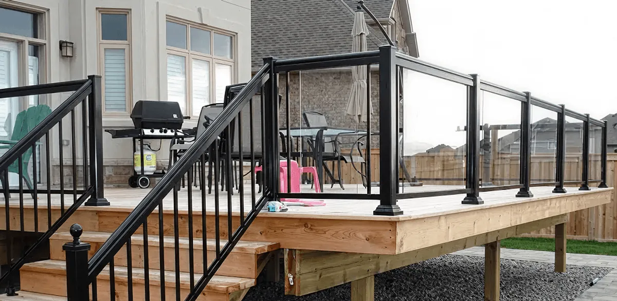 Handrail installation on a deck staircase for safety and code compliance in Des Moines, IA