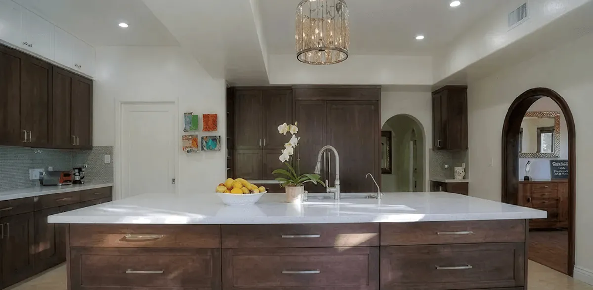 Cabinet refacing project with updated kitchen cabinets and island in Des Moines, IA